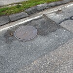 Pothole at 400–410 Heath St, Chestnut Hill